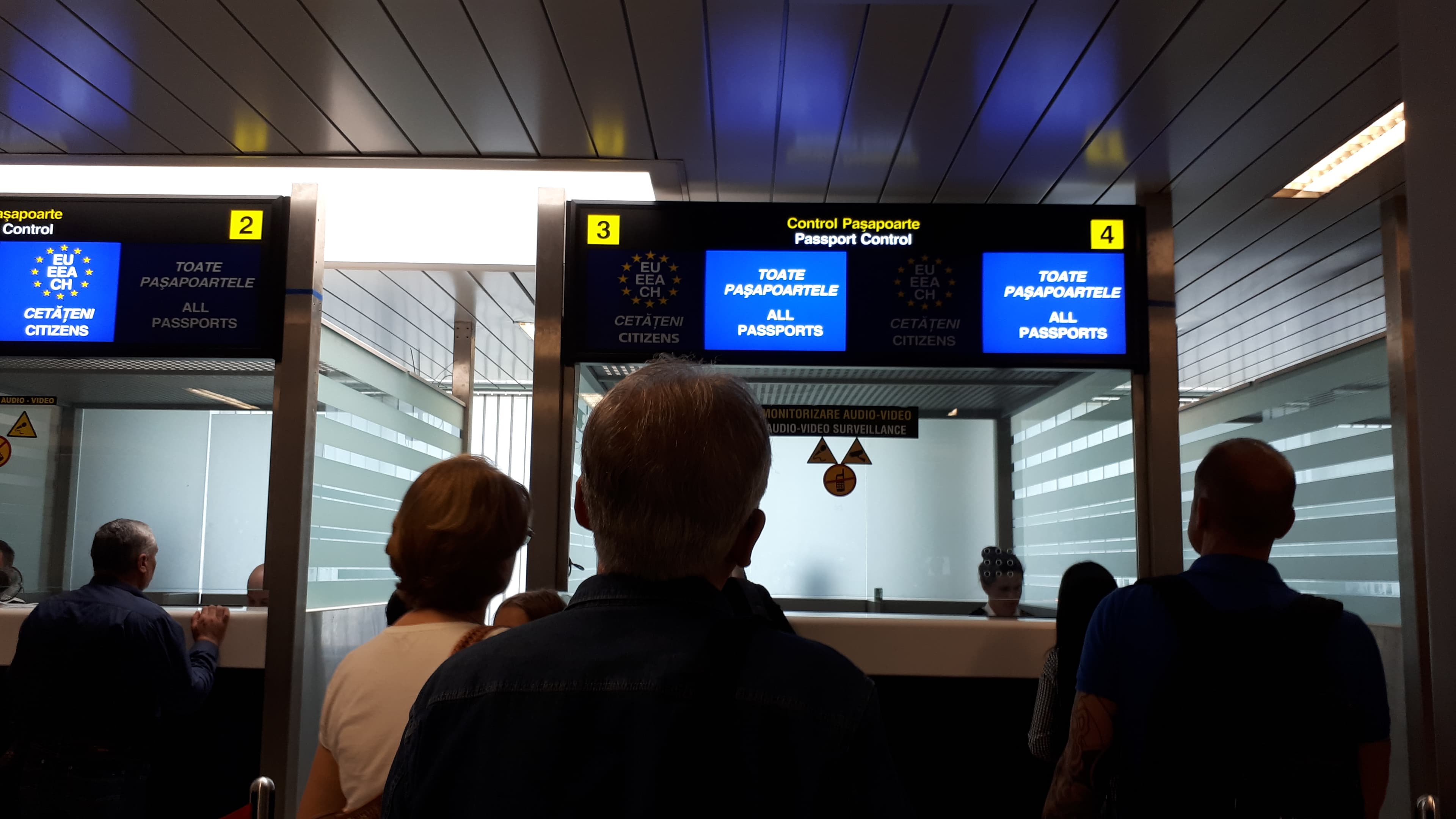 People lining up for visa or passport control